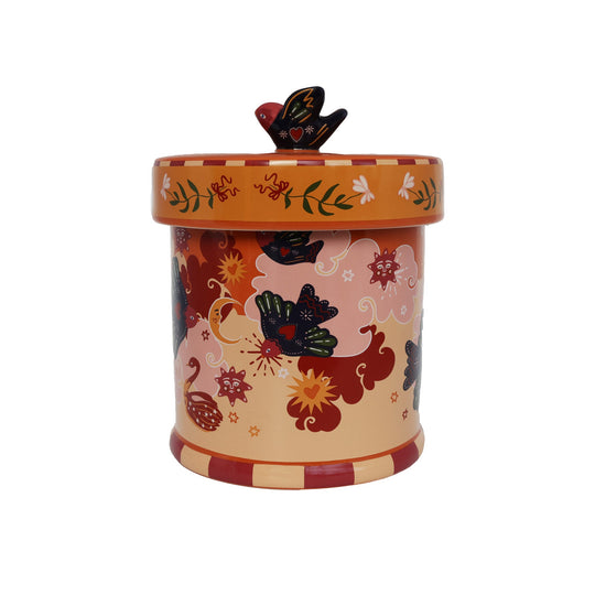 Orange keramikkrukke med fugle